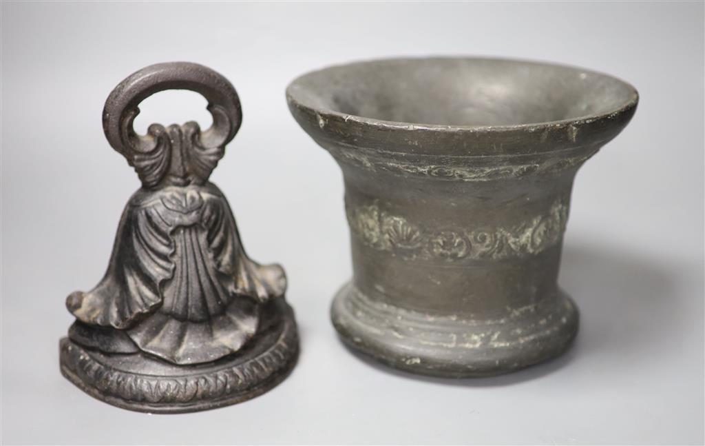 A 16th/17th century bronze mortar, height 16cm, and a cast iron doorstop